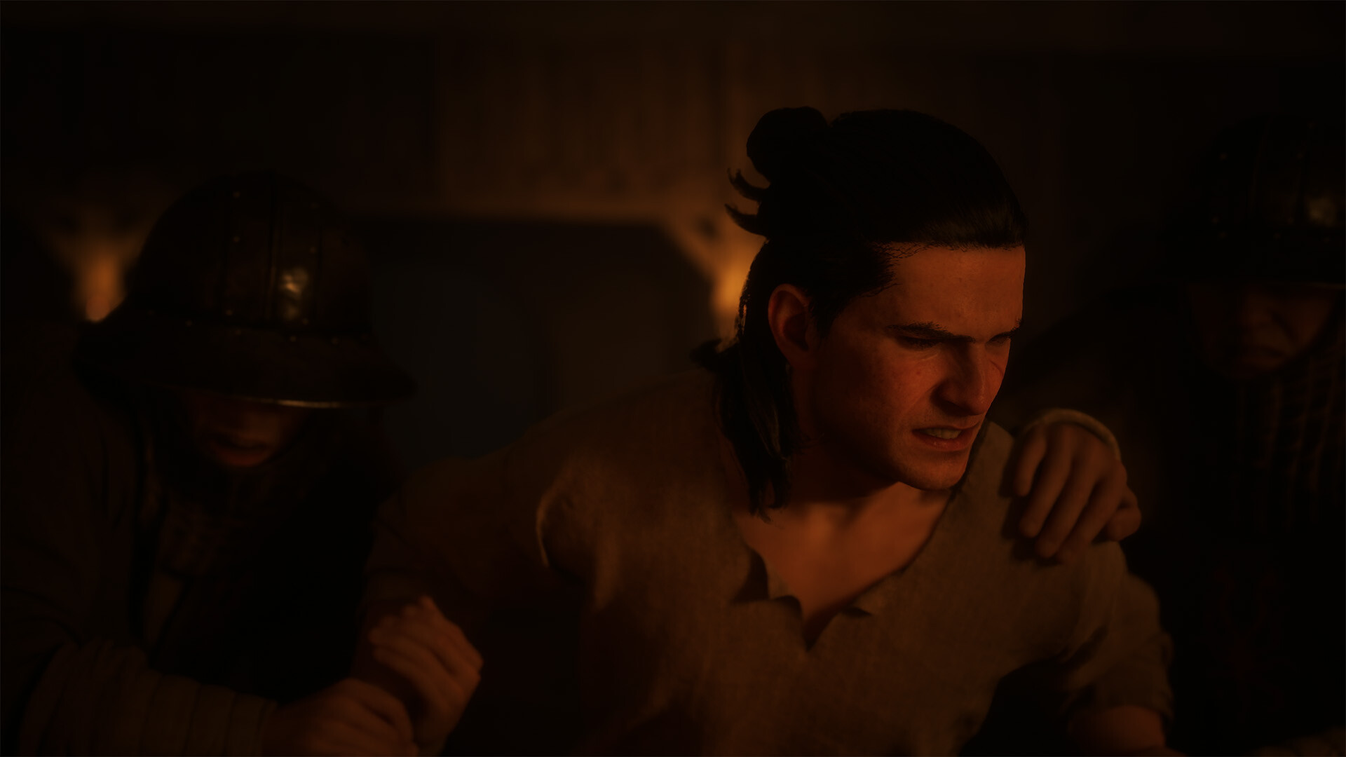 The Blood of Dawnwalker shows Coen held by helmeted soldiers in a dim torchlit interior during the prologue